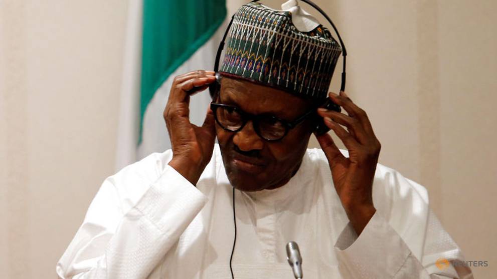 nigeria-s-president-muhammadu-buhari-adjusts-his-translation-device-during-a-news-conference-at-the-presidential-villa-in-abuja-1