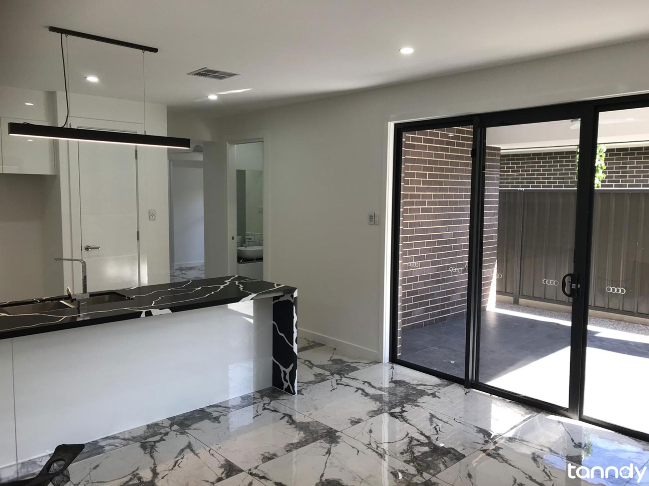 Entrance area with black marble tiles